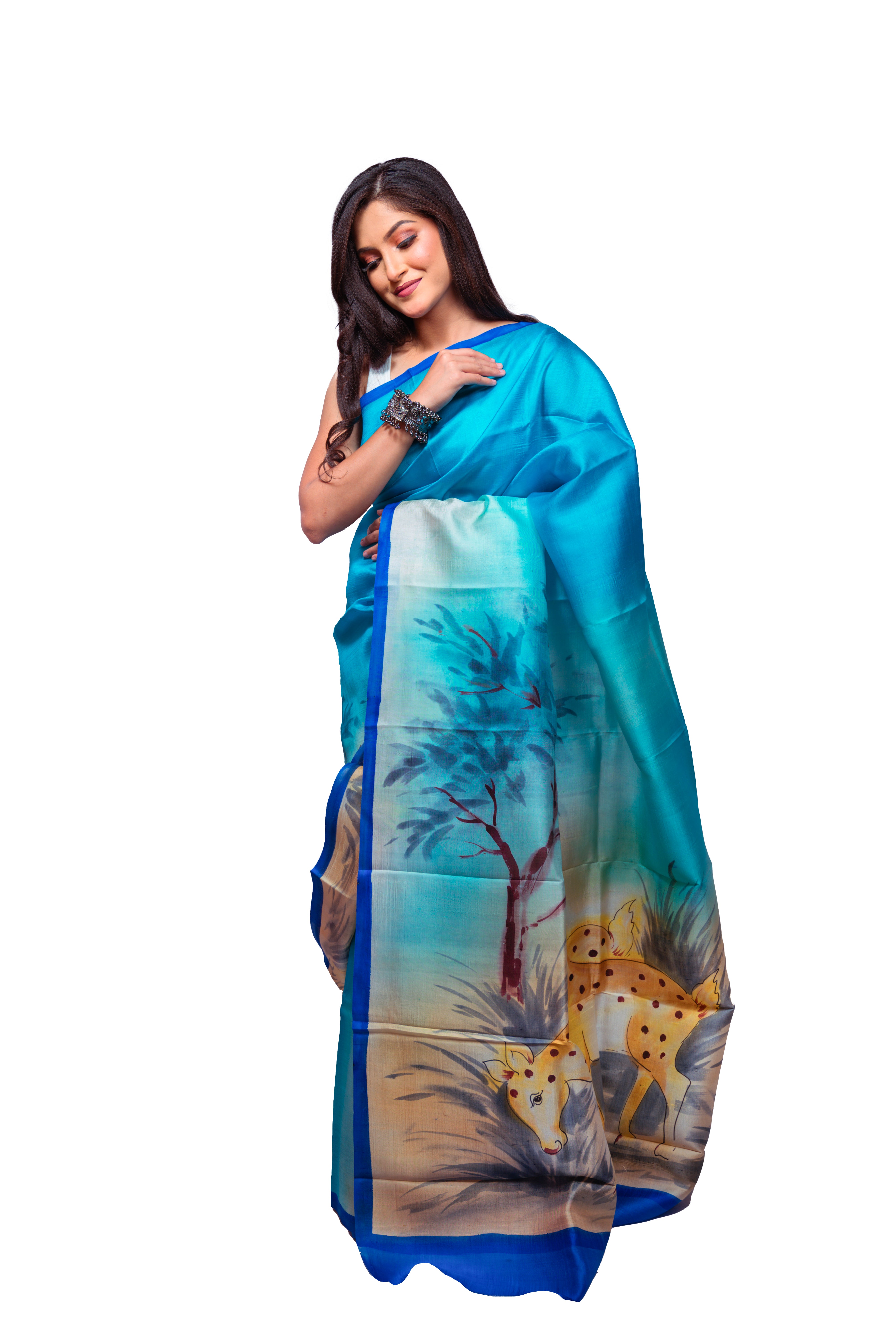 Shades of blue with cream undertones and artistic motifs silk saree